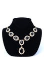 Necklaces with gems on a mannequin isolated on white Royalty Free Stock Photo
