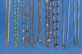 Necklaces gold on blue cloth Royalty Free Stock Photo