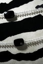 Necklaces over black white zebra background