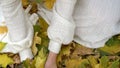 Neckline girl hands with autumn leaves then face