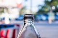 A necks of clear glass bottles in the sunlight