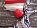 Necktie, heart, gift box festive romantic celebrate old black wooden background, happy father`s day, retro