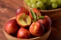 Nectarine. Ripe juicy organic nectarines  in a wooden bowl. Royalty Free Stock Photo