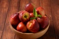 Nectarine. Ripe juicy organic nectarines in a wooden bowl.