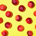 Nectarines pattern on yellow background. Frame made of fresh fruits. Flat lay, top view, copy space. Vegan and vegetarian diet Royalty Free Stock Photo