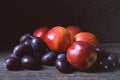 Nectarines plums damsons dark wood Royalty Free Stock Photo