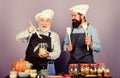 Need advice. Halloween pumpkin recipe. mature senior bearded men in kitchen. cereals and seasoning. professional Royalty Free Stock Photo