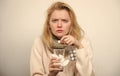Need another antibiotic. Cute sick girl taking anti cold pills. Unhealthy woman holding pills and water glass. Ill woman Royalty Free Stock Photo