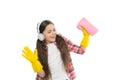 need help. Cleaning supplies. small girl earphones in yellow rubber gloves. happy cleaning sunday. listen music while Royalty Free Stock Photo