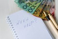 `Need help ` text on notepad and australian dollars Royalty Free Stock Photo