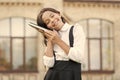 Need for sleep. School education concept. Cute smiling sleepy child hold book. Little girl school student. Knowledge day Royalty Free Stock Photo