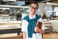 Need Smile. Take it. Confident asian female office worker posing indoors Royalty Free Stock Photo