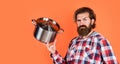 Need some help. housekeep husband cook in pot. mature chef in checkered shirt. prepare meal food at home. professional Royalty Free Stock Photo