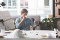 Skillful youthful architect enjoying fresh espresso