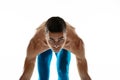 Portrait of young professional male athlete, runner isolated on white studio background. Muscular, sportive man. Concept Royalty Free Stock Photo