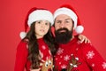 Need to cheer up. small girl and dad santa hat. daddy and kid red background. christmas time. new year party. happy to