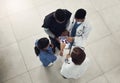 We need to have a quick meeting. a group of doctors and nurses using a digital tablet during their meeting. Royalty Free Stock Photo