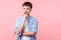 Need to think! Portrait of thoughtful brown-haired man with small beard and mustache looking aside. indoor studio shot on