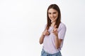 We need you. Young confident woman pointing fingers at camera, searching for employees, recruit people, praising for Royalty Free Stock Photo