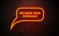 We Need Your Feedback Neon sign in Bubble Speech on Brick wall background. customer feedback Concept Royalty Free Stock Photo