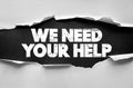 WE NEED YOUR HELP text written on torn paper background. Motivational message, call for support, request for assistance or Royalty Free Stock Photo