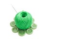 Needle, green plastic buttons and thread Royalty Free Stock Photo