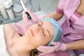 Needle mesotherapy. Cosmetologist performs needle mesotherapy on a womans face Royalty Free Stock Photo