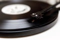 A needle playing an old vinyl. Close-up view Royalty Free Stock Photo