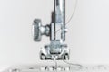 Needle and presser foot of a sewing machine as extreme macro shot, technical invention for the clothing industry, bright Royalty Free Stock Photo