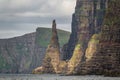 Needle rock in the steep coastline of Faroe Islands