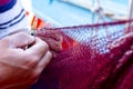 Fisherman is fixing the fish net Royalty Free Stock Photo