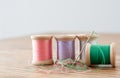 Needle and Four Spools of Thread Royalty Free Stock Photo