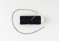 Needle and thread. Needlework object, color cotton thread spool and needle Royalty Free Stock Photo