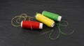 Needle and thread. Needlework object, color cotton thread spool and needle Royalty Free Stock Photo