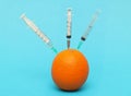 Orange injected by needles