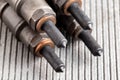 Needles and nozzles on nozzles from a diesel engine. Deterioration of the fuel system of the car, macro Royalty Free Stock Photo