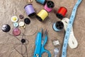 Needles and reels of colored cotton on a work table