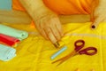 Needlework and hand quilting in the workshop of a tailor woman -