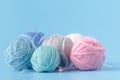 Needlework hobby concept. Wool clews on blue background Royalty Free Stock Photo