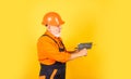 He needs little break. Plasterer in working uniform plastering. man with spatula. process of applying layer of putty Royalty Free Stock Photo