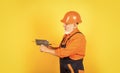 He needs little break. Plasterer in working uniform plastering. man with spatula. process of applying layer of putty Royalty Free Stock Photo