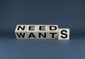 Needs or Wants. Cubes form the choice words Needs or Wants Royalty Free Stock Photo