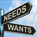 Needs Wants Signpost Means Necessity And Desire Royalty Free Stock Photo