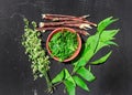 neem leaves and flowers with ayurvedic nim paste ,neem paste and flowers or leafs on selective focus Royalty Free Stock Photo
