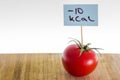 Negative-calories food, tomato on a cutting board