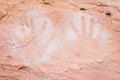 Negative hand prints made with white paint sprayed on wall Royalty Free Stock Photo