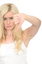 Negative Unhappy Sad Young Woman Giving a Thumbs Down Hand Sign Royalty Free Stock Photo