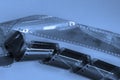 Negatives of old black and white photographic films on blue background. Photo, movie, cinema concept Royalty Free Stock Photo