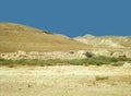 Desert landscape with rocks, hills and mountains