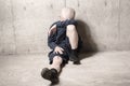 Neglected lonely child leaning at the wall Royalty Free Stock Photo